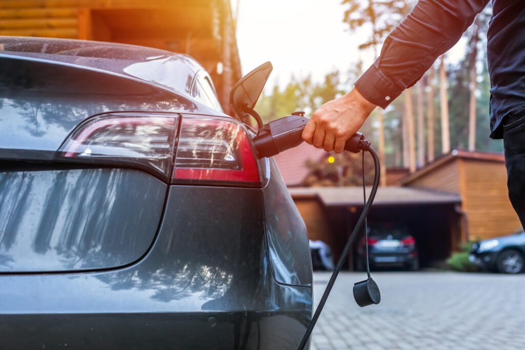Image of someone charging electric car
